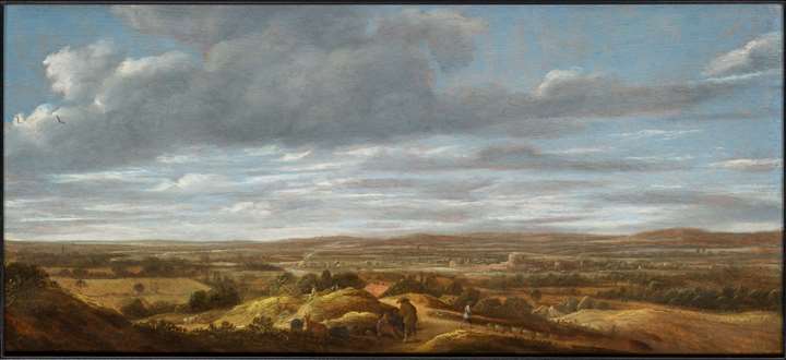 An extensive landscape with huntsmen resting on a path, a town beyond.